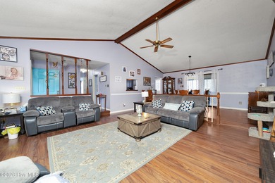 Tucked away on a wooded lot in Fairfield Harbour, this inviting on Harbour Point Golf Club in North Carolina - for sale on GolfHomes.com, golf home, golf lot