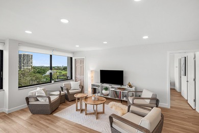 Sunlit Corner Unit with sweeping Golf Course Views in a highly on  in Florida - for sale on GolfHomes.com, golf home, golf lot