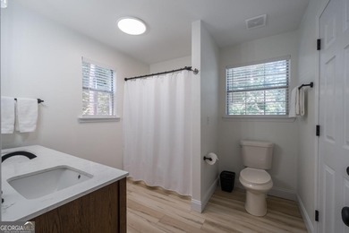 Come home to this impeccably maintained 3 BR/3 BA mountain cabin on White Path Golf Club in Georgia - for sale on GolfHomes.com, golf home, golf lot