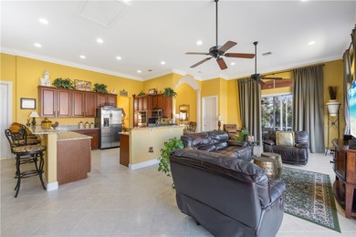 Meticulously landscaped courtyard entry, sculpted gardens and on Bent Pine Golf Club in Florida - for sale on GolfHomes.com, golf home, golf lot