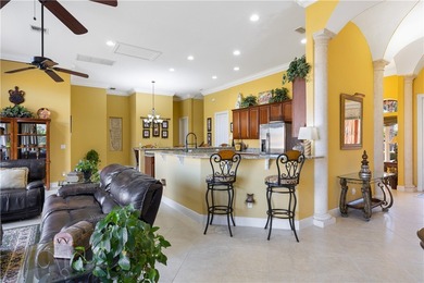 Meticulously landscaped courtyard entry, sculpted gardens and on Bent Pine Golf Club in Florida - for sale on GolfHomes.com, golf home, golf lot