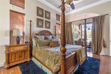 Meticulously landscaped courtyard entry, sculpted gardens and on Bent Pine Golf Club in Florida - for sale on GolfHomes.com, golf home, golf lot