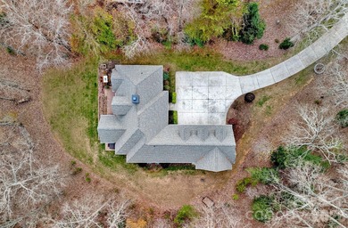 Embrace lake life at its finest in this truly exceptional on Old North State Club at Uwharrie Point Golf community in North Carolina - for sale on GolfHomes.com, golf home, golf lot