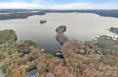 Embrace lake life at its finest in this truly exceptional on Old North State Club at Uwharrie Point Golf community in North Carolina - for sale on GolfHomes.com, golf home, golf lot