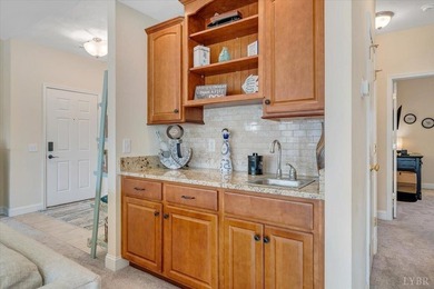 Enjoy effortless lake living in this top-floor 2-bedroom, 2-bath on The Waterfront Country Club in Virginia - for sale on GolfHomes.com, golf home, golf lot