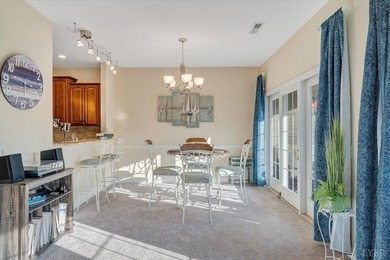 Enjoy effortless lake living in this top-floor 2-bedroom, 2-bath on The Waterfront Country Club in Virginia - for sale on GolfHomes.com, golf home, golf lot