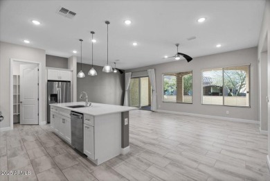 Experience luxury living in this impeccable 2-bedroom PLUS DEN on Tuscany Falls At Pebble Creek in Arizona - for sale on GolfHomes.com, golf home, golf lot
