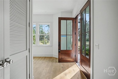 An elegant new construction carriage house offering refined on The Ford Field and River Club  in Georgia - for sale on GolfHomes.com, golf home, golf lot