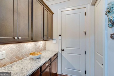 Nestled in the heart of The Georgia Club, 2189 Bessbrook Square on The Georgia Club in Georgia - for sale on GolfHomes.com, golf home, golf lot