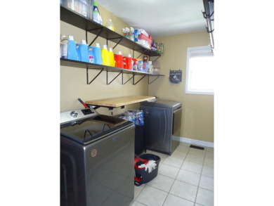 Welcome to this spacious and inviting 4-bedroom, 2.5-bath home on Paintsville Country Club in Kentucky - for sale on GolfHomes.com, golf home, golf lot