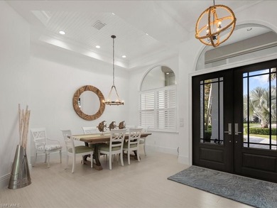 Gracefully positioned on an exceptionally private preserve on Bay Colony Golf Club in Florida - for sale on GolfHomes.com, golf home, golf lot