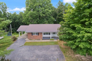 Embrace the golfer's lifestyle in this picturesque brick ranch on Beattyville Country Club in Kentucky - for sale on GolfHomes.com, golf home, golf lot