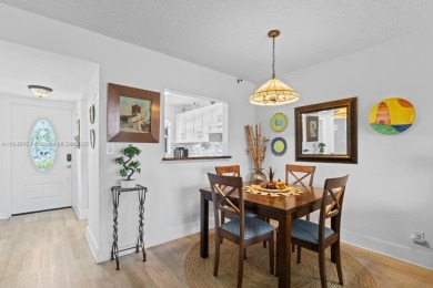 Spectacular remodeled first-floor condo with stunning lake view on Sunrise Lakes Phase III in Florida - for sale on GolfHomes.com, golf home, golf lot