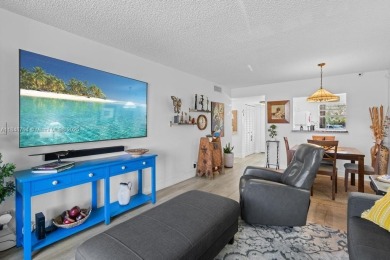 Spectacular remodeled first-floor condo with stunning lake view on Sunrise Lakes Phase III in Florida - for sale on GolfHomes.com, golf home, golf lot