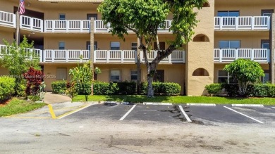 Spectacular remodeled first-floor condo with stunning lake view on Sunrise Lakes Phase III in Florida - for sale on GolfHomes.com, golf home, golf lot