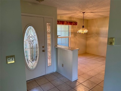 Come make this Highland Lakes home your own. Three bedrooms in on Highland Lakes Executive Golf Course in Florida - for sale on GolfHomes.com, golf home, golf lot