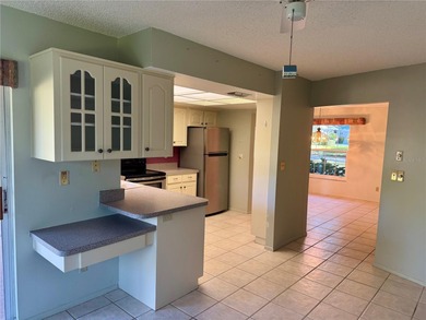 Come make this Highland Lakes home your own. Three bedrooms in on Highland Lakes Executive Golf Course in Florida - for sale on GolfHomes.com, golf home, golf lot