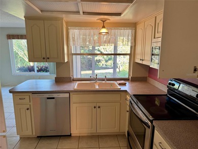 Come make this Highland Lakes home your own. Three bedrooms in on Highland Lakes Executive Golf Course in Florida - for sale on GolfHomes.com, golf home, golf lot