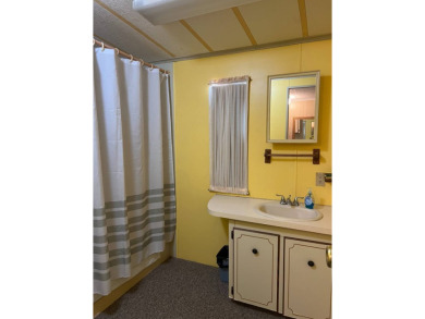 Welcome to this cozy and inviting home perfectly situated on a on Lake Henry Golf Club in Florida - for sale on GolfHomes.com, golf home, golf lot