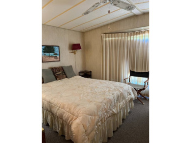 Welcome to this cozy and inviting home perfectly situated on a on Lake Henry Golf Club in Florida - for sale on GolfHomes.com, golf home, golf lot