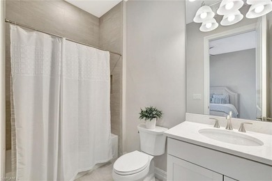 Indulge in modern luxury at this exquisite STOCK LUXURY home in on The Golf Club At Fiddlers Creek in Florida - for sale on GolfHomes.com, golf home, golf lot