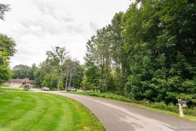 Vacant land in the prestigious Timber Point Estates ready for on The Timbers Golf Club in Michigan - for sale on GolfHomes.com, golf home, golf lot