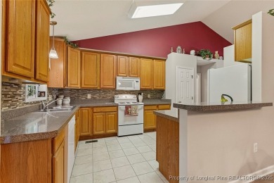 Beautiful 3-bedroom, 2-bath home with a finished bonus room over on Carolina Trace Country Club in North Carolina - for sale on GolfHomes.com, golf home, golf lot