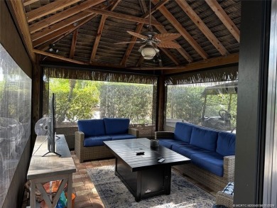 Truly an enchanting tropical retreat! Positioned on the on Motorcoach Resort Golf Course in Florida - for sale on GolfHomes.com, golf home, golf lot