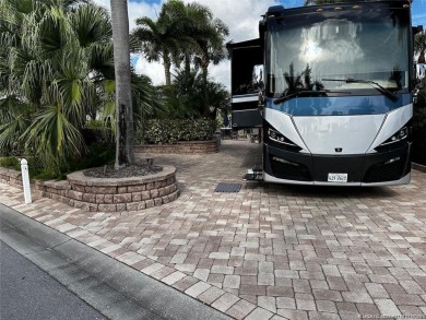 Truly an enchanting tropical retreat! Positioned on the on Motorcoach Resort Golf Course in Florida - for sale on GolfHomes.com, golf home, golf lot