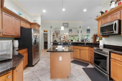 This stunning 3/2 MAGNOLIA single-family home is situated in the on Amberwood Executive Golf Course in Florida - for sale on GolfHomes.com, golf home, golf lot