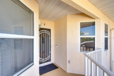 Enjoy stunning lake and golf course views from this lovely on Terra Ceia Golf and Country Club in Florida - for sale on GolfHomes.com, golf home, golf lot