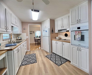 This charming home is truly in wonderful condition and has been on Fairway Village Golf Course in Florida - for sale on GolfHomes.com, golf home, golf lot