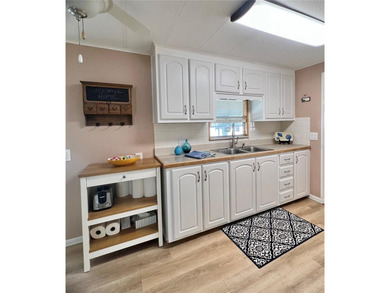 This charming home is truly in wonderful condition and has been on Fairway Village Golf Course in Florida - for sale on GolfHomes.com, golf home, golf lot