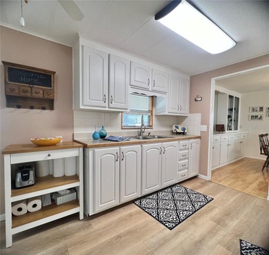 This charming home is truly in wonderful condition and has been on Fairway Village Golf Course in Florida - for sale on GolfHomes.com, golf home, golf lot