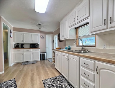 This charming home is truly in wonderful condition and has been on Fairway Village Golf Course in Florida - for sale on GolfHomes.com, golf home, golf lot