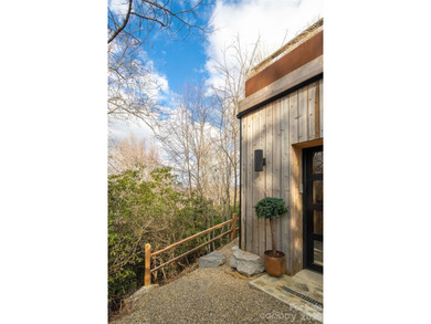 Stunning, Mountain-Modern Retreat in the Private, gated enclave on Connestee Falls Golf Club in North Carolina - for sale on GolfHomes.com, golf home, golf lot