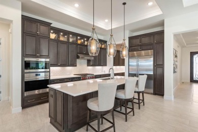 Experience the height of luxury in this stunning Avalon home on Wildhorse Golf Club of Robson Ranch in Texas - for sale on GolfHomes.com, golf home, golf lot