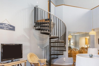 Penthouse condo with high vaulted ceilings and panoramic views on Pointe Royale Village Country Club in Missouri - for sale on GolfHomes.com, golf home, golf lot