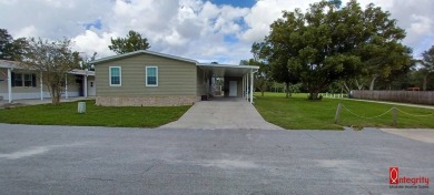 Come settle down and relax in a beautiful manufactured home with on Fairways Country Club in Florida - for sale on GolfHomes.com, golf home, golf lot