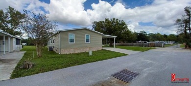 Come settle down and relax in a beautiful manufactured home with on Fairways Country Club in Florida - for sale on GolfHomes.com, golf home, golf lot