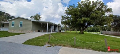 Come settle down and relax in a beautiful manufactured home with on Fairways Country Club in Florida - for sale on GolfHomes.com, golf home, golf lot