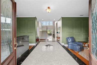 This onc of a kind residence sits on over 1.3 acres with serene on East Lake Woodlands Country Club in Florida - for sale on GolfHomes.com, golf home, golf lot