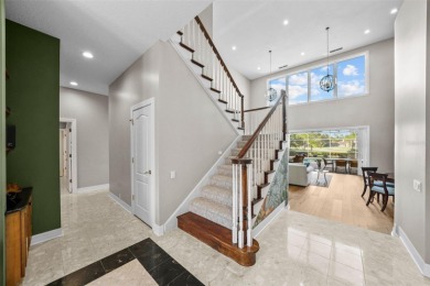 This onc of a kind residence sits on over 1.3 acres with serene on East Lake Woodlands Country Club in Florida - for sale on GolfHomes.com, golf home, golf lot