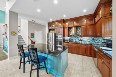 This onc of a kind residence sits on over 1.3 acres with serene on East Lake Woodlands Country Club in Florida - for sale on GolfHomes.com, golf home, golf lot