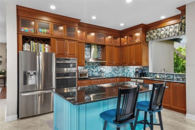 This onc of a kind residence sits on over 1.3 acres with serene on East Lake Woodlands Country Club in Florida - for sale on GolfHomes.com, golf home, golf lot