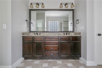 Stunning, semi-custom home located in the highly sought gated on Anderson Creek Golf Club in North Carolina - for sale on GolfHomes.com, golf home, golf lot