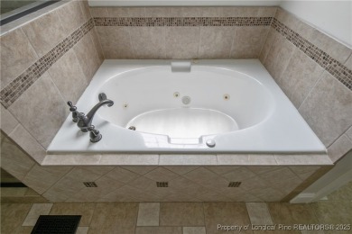 Stunning, semi-custom home located in the highly sought gated on Anderson Creek Golf Club in North Carolina - for sale on GolfHomes.com, golf home, golf lot