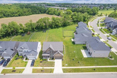 Located in the amenity-rich Shaker Run community with pools on Shaker Run Golf Club  in Ohio - for sale on GolfHomes.com, golf home, golf lot