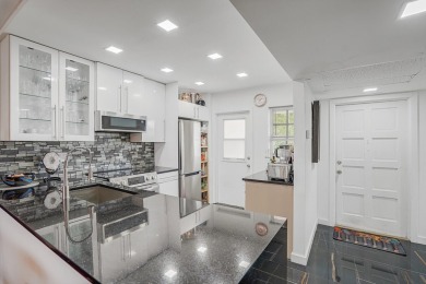 Wake up to sparkling lake views in this bright 1BR/1.5BA Palm on Palm-Aire Country Club and Resort - The Oaks in Florida - for sale on GolfHomes.com, golf home, golf lot
