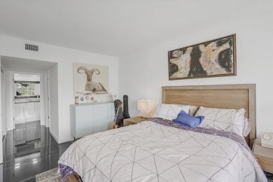 Wake up to sparkling lake views in this bright 1BR/1.5BA Palm on Palm-Aire Country Club and Resort - The Oaks in Florida - for sale on GolfHomes.com, golf home, golf lot